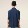 Ami de Coeur Polo de algodón azul con parche bordado Ami de Coeur Polo de algodón azul con parche bordado
