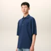 Ami de Coeur Polo de algodón azul con parche bordado Ami de Coeur Polo de algodón azul con parche bordado