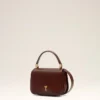 Bolso Paris Paris con asa de piel barnizada en color burdeos Bolso Paris Paris con asa de piel barnizada en color burdeos