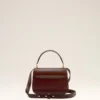Bolso Paris Paris con asa de piel barnizada en color burdeos Bolso Paris Paris con asa de piel barnizada en color burdeos