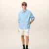 Camisa ancha de algodón azul con cuello de punta de Ami de Coeur Camisa ancha de algodón azul con cuello de punta de Ami de Coeur