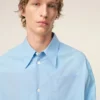 Camisa ancha de algodón azul con cuello de punta de Ami de Coeur Camisa ancha de algodón azul con cuello de punta de Ami de Coeur