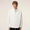 Camisa ancha de algodón blanco con cuello de punta y Ami de Coeur Camisa ancha de algodón blanco con cuello de punta y Ami de Coeur