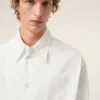 Camisa ancha de algodón blanco con cuello de punta y Ami de Coeur Camisa ancha de algodón blanco con cuello de punta y Ami de Coeur