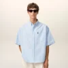 Camisa azul de algodón de corte holgado con bordados «Ami de Coeur»