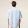 Camisa azul de algodón de corte holgado con bordados «Ami de Coeur»