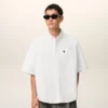 Camisa blanca de algodón de corte holgado con bordado Ami de Coeur Camisa blanca de algodón de corte holgado con bordado Ami de Coeur