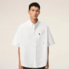 Camisa blanca de algodón de corte holgado con bordado Ami de Coeur Camisa blanca de algodón de corte holgado con bordado Ami de Coeur