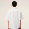 Camisa blanca de algodón de corte holgado con bordado Ami de Coeur Camisa blanca de algodón de corte holgado con bordado Ami de Coeur