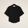 Camisa negra de manga corta con bordado «Ami Paris» y corte holgado
