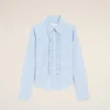 Camisas ajustadas de manga larga con volantes de algodón azul Camisas ajustadas de manga larga con volantes de algodón azul