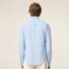 Camisas ajustadas de manga larga con volantes de algodón azul Camisas ajustadas de manga larga con volantes de algodón azul