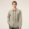 Camisas ajustadas de manga larga con volantes de algodón beige Camisas ajustadas de manga larga con volantes de algodón beige