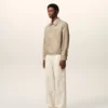 Chaqueta Ami de Coeur de nailon beige con botones de presión