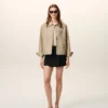 Chaqueta Ami de Coeur de nailon beige con botones de presión