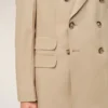Chaqueta recta de doble botonadura en lana nueva de color beige Chaqueta recta de doble botonadura en lana nueva de color beige