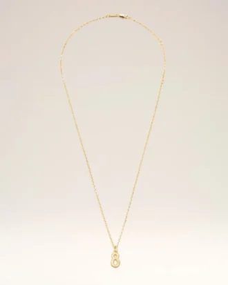 Collar con colgante «8» de latón dorado martillado