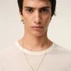 Collar con colgante «9» de latón dorado martillado