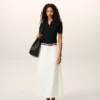 Falda larga trapecio de confección sartorial en mezcla de lino blanco Falda larga trapecio de confección sartorial en mezcla de lino blanco