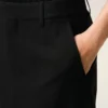 Falda larga trapecio de confección sastrera en mezcla de lino negro Falda larga trapecio de confección sastrera en mezcla de lino negro