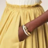 Falda midi Corolla de algodón amarillo Falda midi Corolla de algodón amarillo