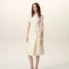 Falda midi de lana nueva blanca con cinturón y hebilla grande Falda midi de lana nueva blanca con cinturón y hebilla grande