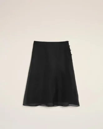 Falda trapecio midi de seda negra con enagua transparente