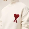 Jersey de cuello alto de lana natural con Ami de Coeur en contraste Jersey de cuello alto de lana natural con Ami de Coeur en contraste