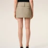 Minifalda cruzada de algodón beige Minifalda cruzada de algodón beige