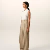 Pantalones anchos de cintura alta de lana nueva en color beige con dos pliegues Pantalones anchos de cintura alta de lana nueva en color beige con dos pliegues