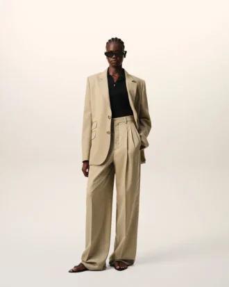 Pantalones beige de lana virgen con cintura alta y pierna ancha