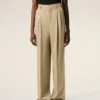 Pantalones beige de lana virgen con cintura alta y pierna ancha Pantalones beige de lana virgen con cintura alta y pierna ancha