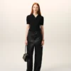 Pantalones con cinturón de satén negro con hebilla Pantalones con cinturón de satén negro con hebilla