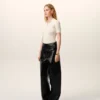 Pantalones con cinturón envuelto en piel de cordero negra
