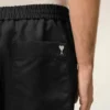 Pantalones cortos Ami de Coeur de nailon negro con cintura elástica y tachuelas