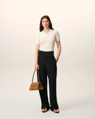Pantalones negros de lana nueva con cinturón cruzado