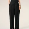 Pantalones negros de lana nueva con cinturón cruzado