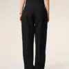 Pantalones negros de lana nueva con cinturón cruzado