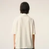 Polo de algodón blanco con parche de punto Ami de Coeur