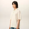 Polo de algodón blanco con parche de punto Ami de Coeur