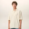 Polo de algodón blanco con parche de punto Ami de Coeur