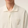Polo de algodón blanco con parche de punto Ami de Coeur