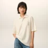 Polo de algodón blanco con parche de punto Ami de Coeur