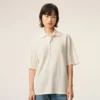 Polo de algodón blanco con parche de punto Ami de Coeur