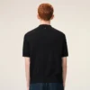 Polo de punto negro de manga corta