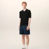 Polo de punto negro de manga corta