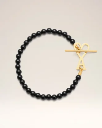 Pulsera Ami De Cœur de latón negro con perlas de verano doradas Pulsera Ami De Cœur de latón negro con perlas de verano doradas