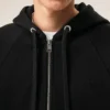 Sudadera con capucha y cremallera Ami de Coeur en algodón negro con relieve Sudadera con capucha y cremallera Ami de Coeur en algodón negro con relieve