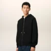 Sudadera con capucha y cremallera Ami de Coeur en algodón negro con relieve Sudadera con capucha y cremallera Ami de Coeur en algodón negro con relieve