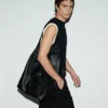 Bolso bandolera Etienne de piel de taurillón negra Bolso bandolera Etienne de piel de taurillón negra